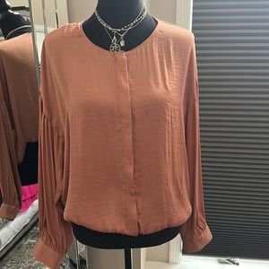 Women’s blouse size M.